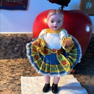 Colorful Traditional rubber and plastic vintage Doll with Blue and Yellow Dress